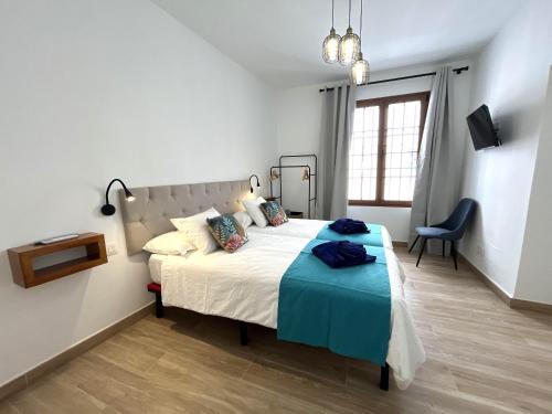 Ένα ή περισσότερα κρεβάτια σε δωμάτιο στο EnvRooms Arrecife