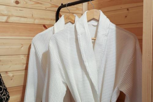 a white shirt is hanging on a rack at Dakidula - დაკიდულა in Ambrolauri