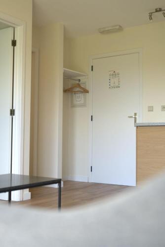 Una cama o camas en una habitación de 't Gulpdal Hotel Voeren-Teuven