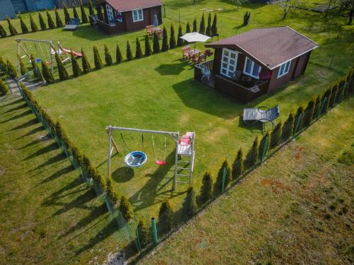an aerial view of a yard with a swing at Atpūtas mājiņas Kolkā- Madaras un Rota in Kolka