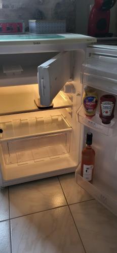 an open refrigerator with some food in it at Les parfums du midi in Saint-Victor-de-Malcap