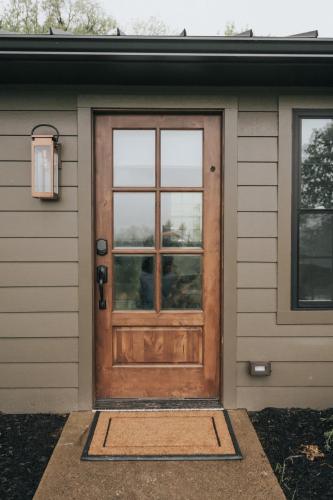 a wooden door on a house with a window at Luxury Cabin at Beaver Creek with hot tub and stunning views in Strasburg