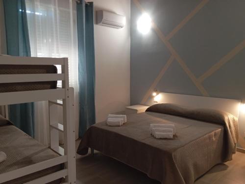 a bedroom with two bunk beds and a ladder at La Praiola in Trappeto