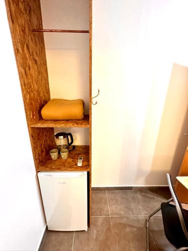 a kitchen with a cupboard with a pillow on it at MT Boutique Suites y Apartamentos - Adults Only - in Mataró
