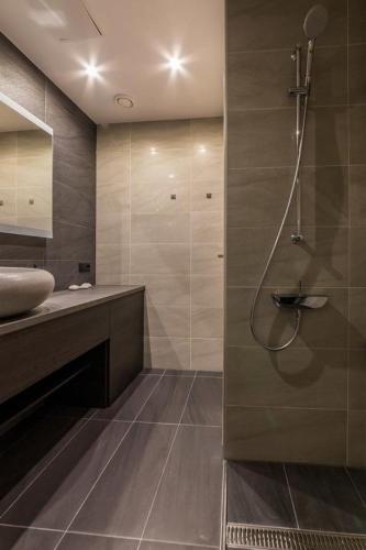 a bathroom with a shower and a sink at Art Academy Apartment in Tallinn