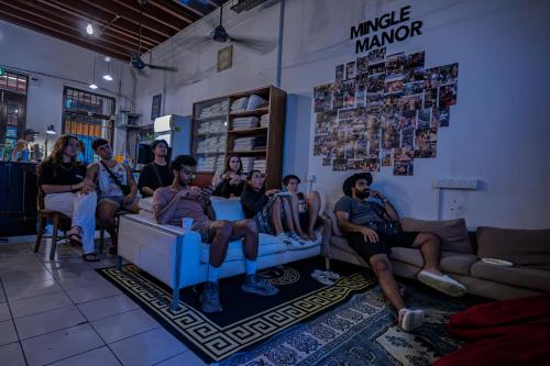 a group of people sitting on couches in a room at The Manor by Mingle - FREE Breakfast with Poolside Access in Kuala Lumpur