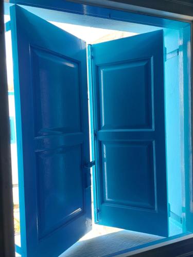 an open door in a building at Ancient Thera Apartments in Kamari