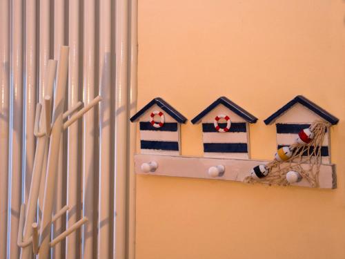 a bird house on the side of a wall at ColleMare in Pesaro
