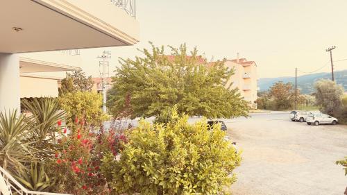 a view of a parking lot with cars parked at Το Φιλόξενο Σπιτάκι! - The Friendly Nest ! in Paralion astros