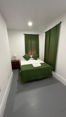 Katil atau katil-katil dalam bilik di Naryn Guest house