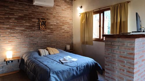 Postel nebo postele na pokoji v ubytování Las Acacias Suites