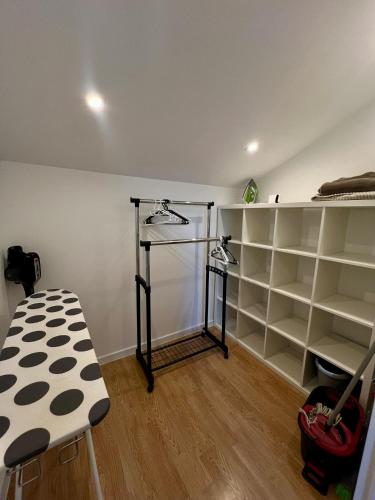 a room with a room with shelves and a table at Apartament ARKON in Hermanowa