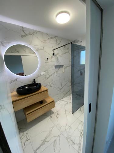 a bathroom with a sink and a mirror at Emily in Slime
