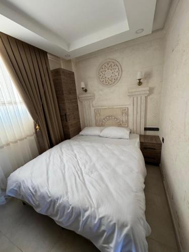 Postel nebo postele na pokoji v ubytování Lalişa Otel