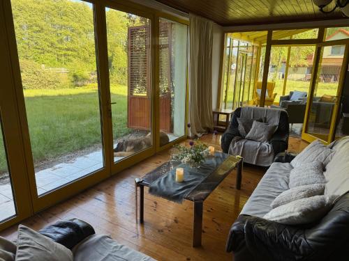a living room with a couch and a table at Oaza Spokoju Pod Warszawą in Marianka