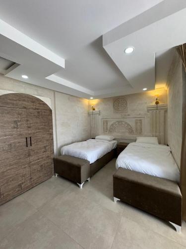 Postel nebo postele na pokoji v ubytování Lalişa Otel