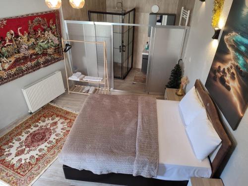 a bedroom with a large white bed and a mirror at Seten House in Urgup