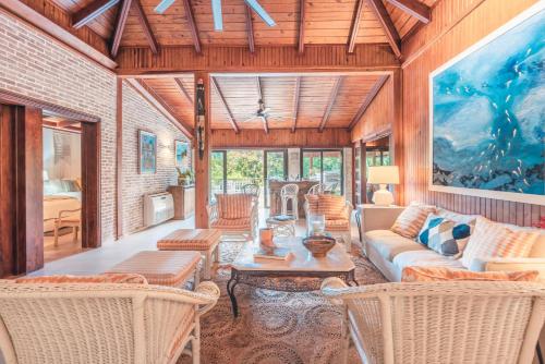 a living room with a couch and chairs and a table at Fun in the sun classic villa at Los Lagos in Casa de Campo in Las Minas