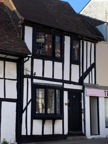 a white and black building with a black door at St Faith's Chambers in Maidstone