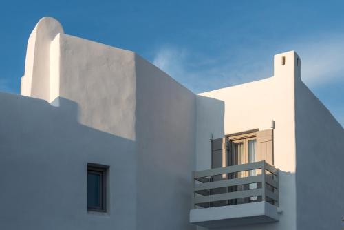 a view of a white building with a balcony at Seven Suites in Glinado Naxos