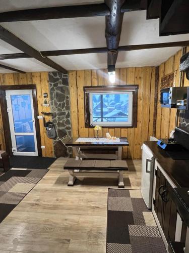 a bathroom with a sink and a stone wall at Файна хата 2 in Synevyrsʼka Polyana