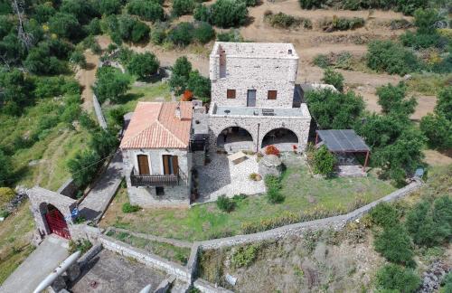 an aerial view of an old house on a hill at Rosso Antico Tower in Kótronas