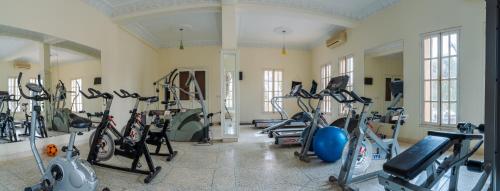 a gym with a bunch of bikes in a room at Palais Du Desert Hotel & Spa in Erfoud