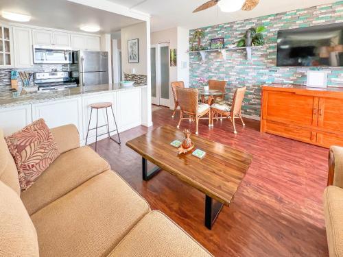 a living room with a couch and a table at Maalaea Kai 215 by Coldwell Banker Island Vacations in Wailuku