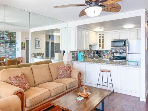 a living room with a couch and a table at Maalaea Kai 215 by Coldwell Banker Island Vacations in Wailuku