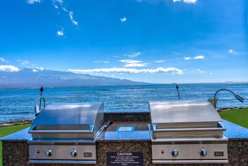 twourgers on a counter with a view of the water at Maalaea Kai 215 by Coldwell Banker Island Vacations in Wailuku