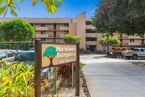 a sign in front of a building with a hotel at Maalaea Banyans 416 by Coldwell Banker Island Vacations in Wailuku