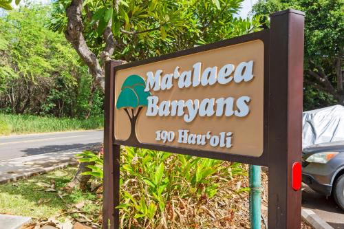a sign for a restaurant on the side of a road at Maalaea Banyans 416 by Coldwell Banker Island Vacations in Wailuku