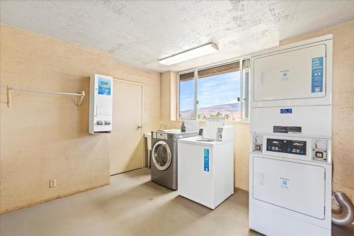 a laundry room with a washer and dryer at Nani Kai Hale 604 by Coldwell Banker Island Vacations in Kihei