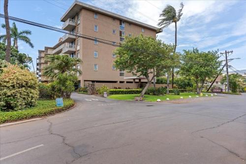 an empty street in front of a building at Nani Kai Hale 604 by Coldwell Banker Island Vacations in Kihei