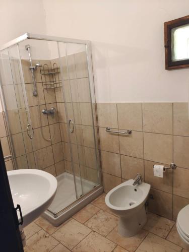 a bathroom with a shower and a toilet and a sink at Il rovero in Castion Veronese