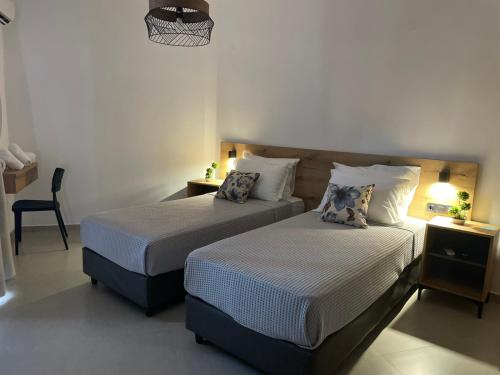 Ένα ή περισσότερα κρεβάτια σε δωμάτιο στο SENSIMAR Rooms To Let