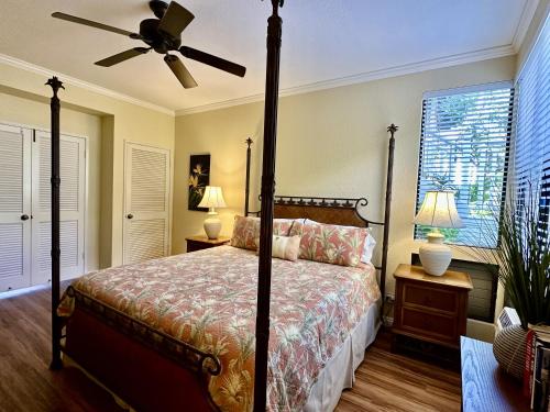 a bedroom with a bed and a ceiling fan at Grand Champions 145 by Coldwell Banker Island Vacations in Wailea