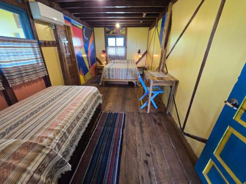 Postel nebo postele na pokoji v ubytování Azuluna Ecolodge