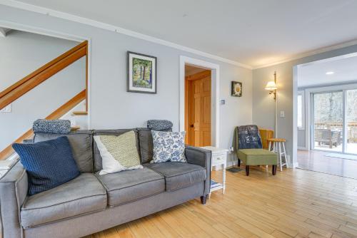 a living room with a couch and a table at Home 2 Mi to Mt Snow Ski, Fish and Hike! in Wardsboro