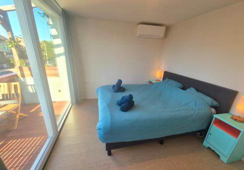 Postel nebo postele na pokoji v ubytování Welkom op Texel, kamer met balkon