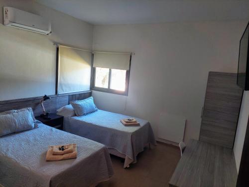 Postel nebo postele na pokoji v ubytování Altos del TALAMPAYA