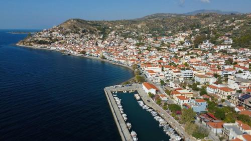 an aerial view of a town next to the water at Elymnion Horizon in Limne