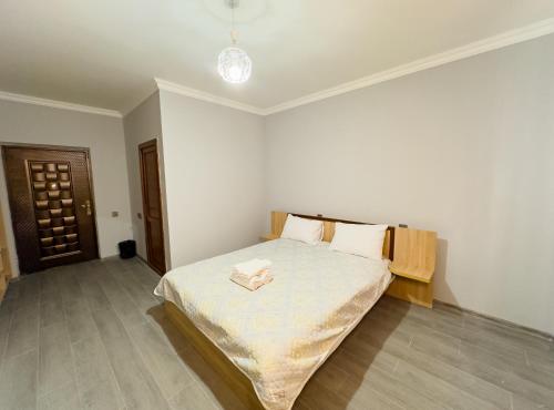 a bedroom with a large bed in a room at River Garden Gabala -Rooms , Villas in Gabala