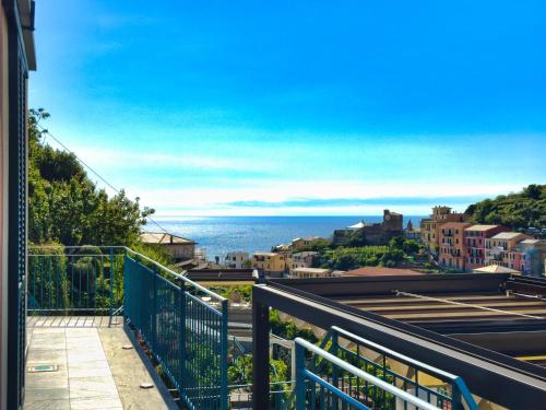 a view of the ocean from the balcony of a house at Cinqueterre Residence in Riomaggiore