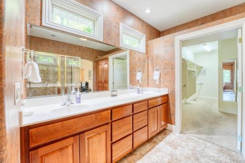 a bathroom with a double sink and a shower at Lakefront Retreat - Near Trails & Family Fun in Bella Vista
