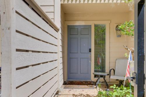 a blue door on a house with a chair at Golf Course Views and Beach Access Shipyard Villa in Hilton Head Island