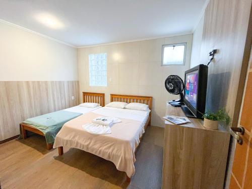 Postel nebo postele na pokoji v ubytování Cantinho - Diamantina MG