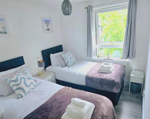 Ένα ή περισσότερα κρεβάτια σε δωμάτιο στο Peckham City Vibes 2BR with Wi-fi and Balcony