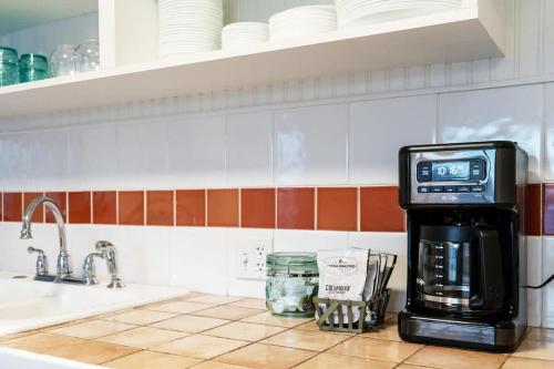 a kitchen with a coffee maker on a counter at Downtown Lava - Views Huge Yard Slide Games in Lava Hot Springs