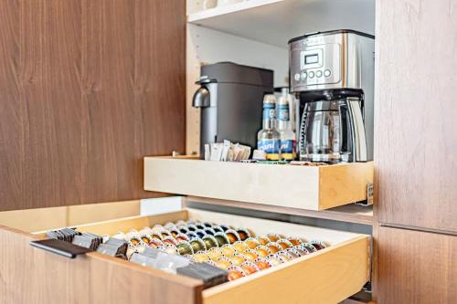 a cupboard with a coffee maker on top of it at Luxury Retreat Epic Views & Hot Tub in Tetonia